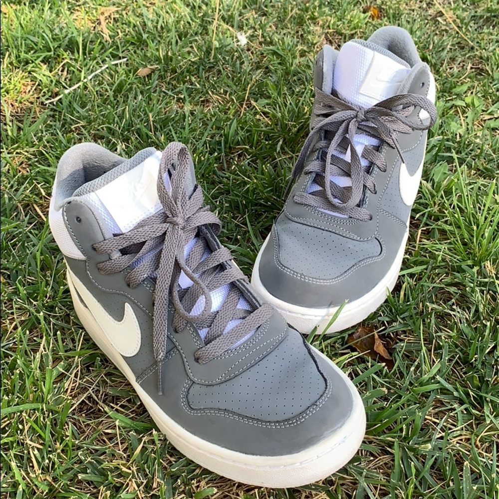 Grey and white high top Nike’s